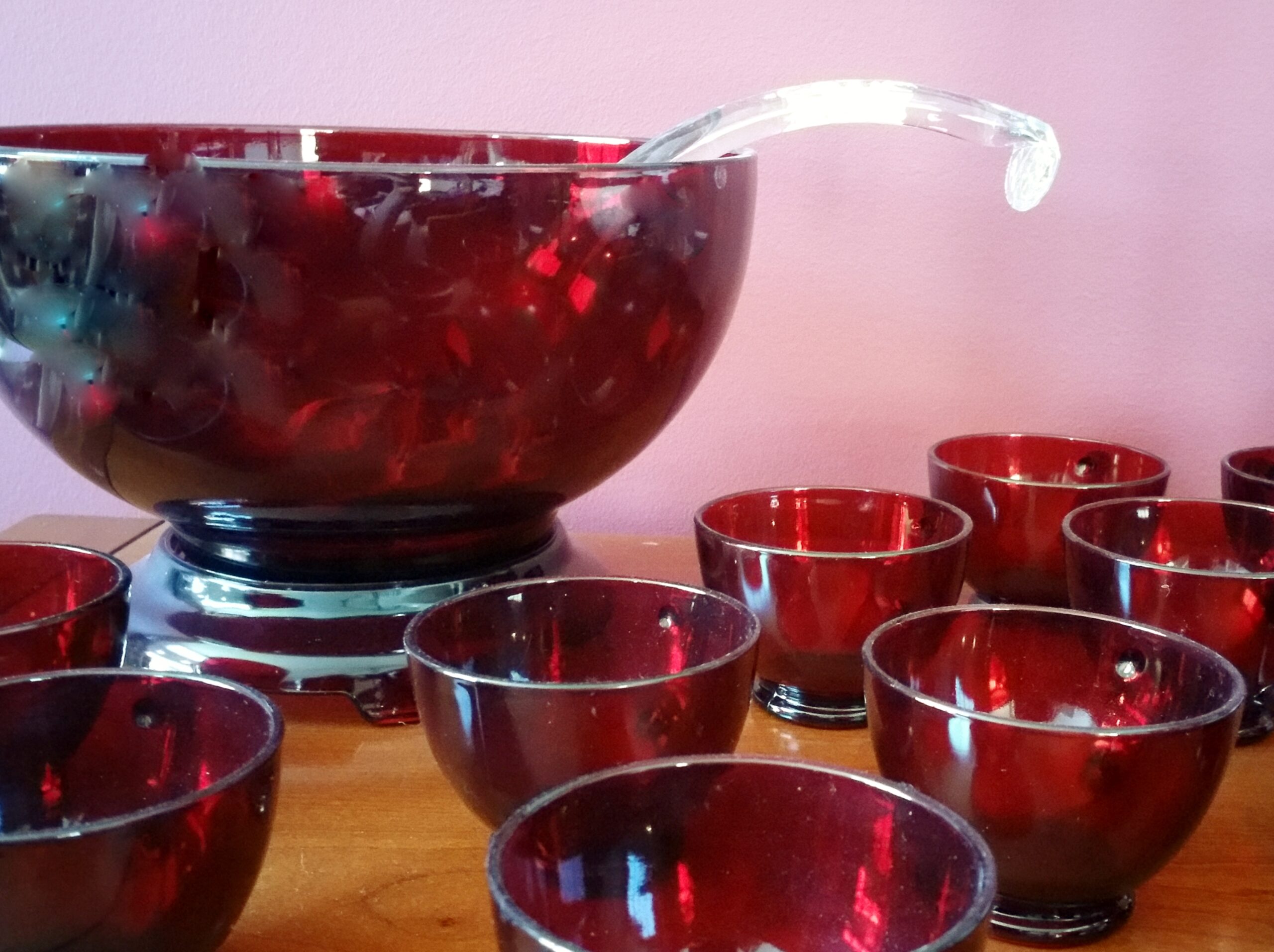 red glass punch bowl with 24 matching cups