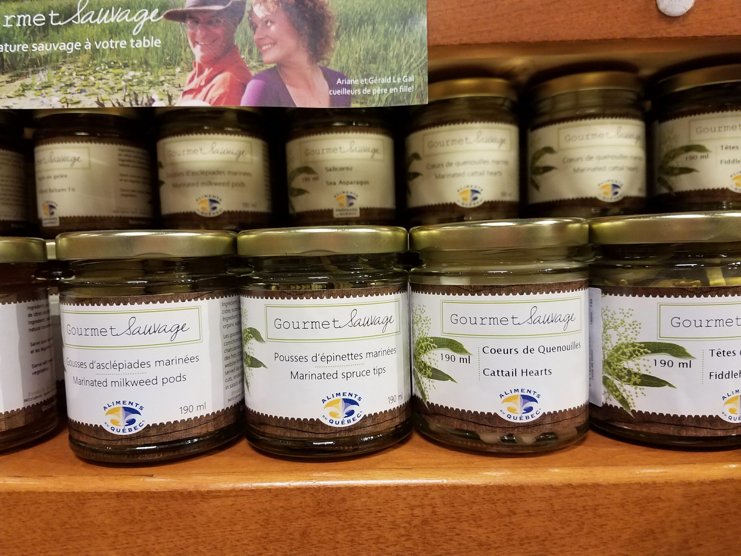 Juneberry jam, cloudberry jam, pickled milkweed pods and marinated cattail hearts
