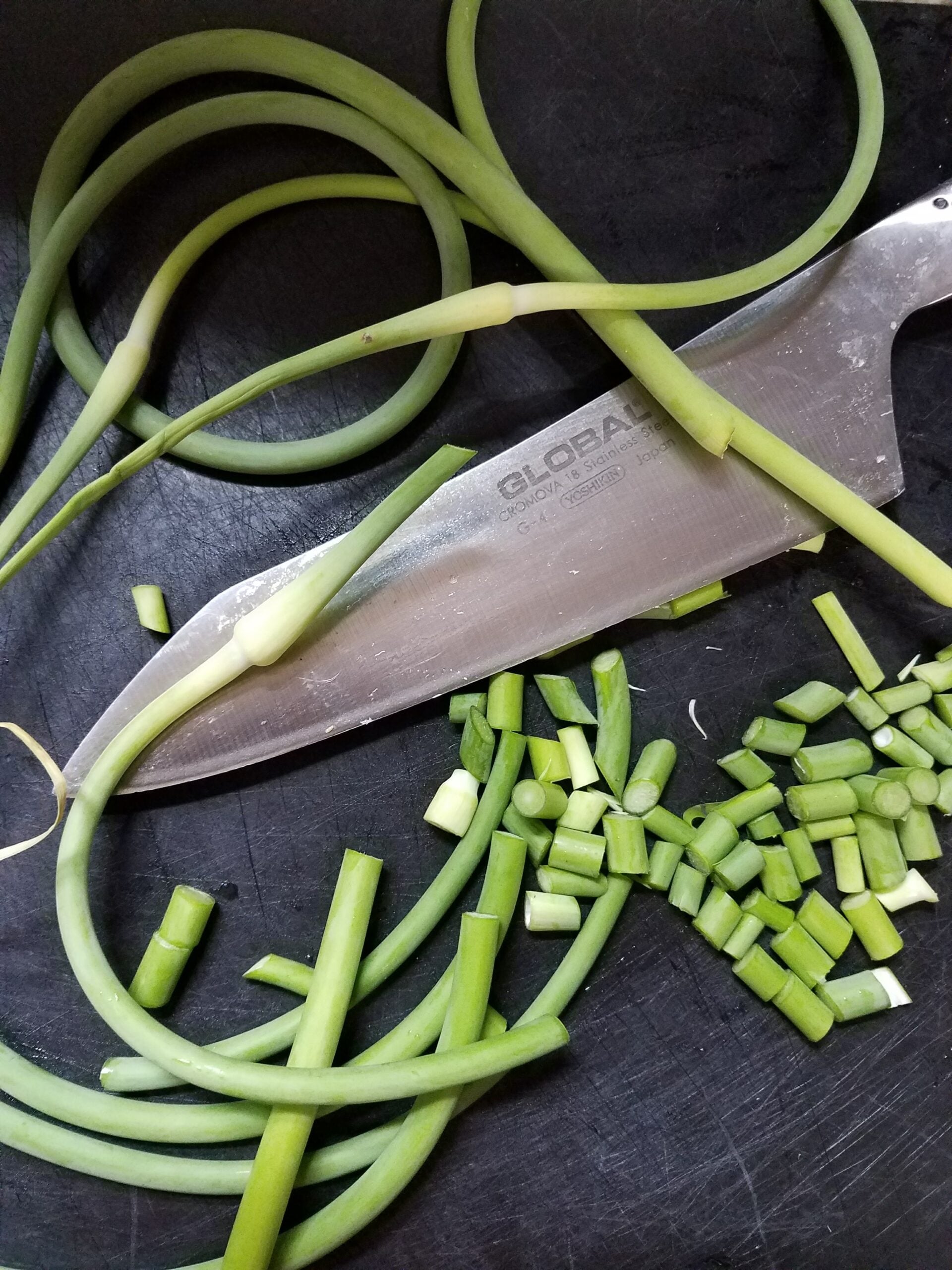 Chop garlic scapes
