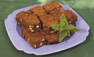 A plate of brownies with cinnamon basil