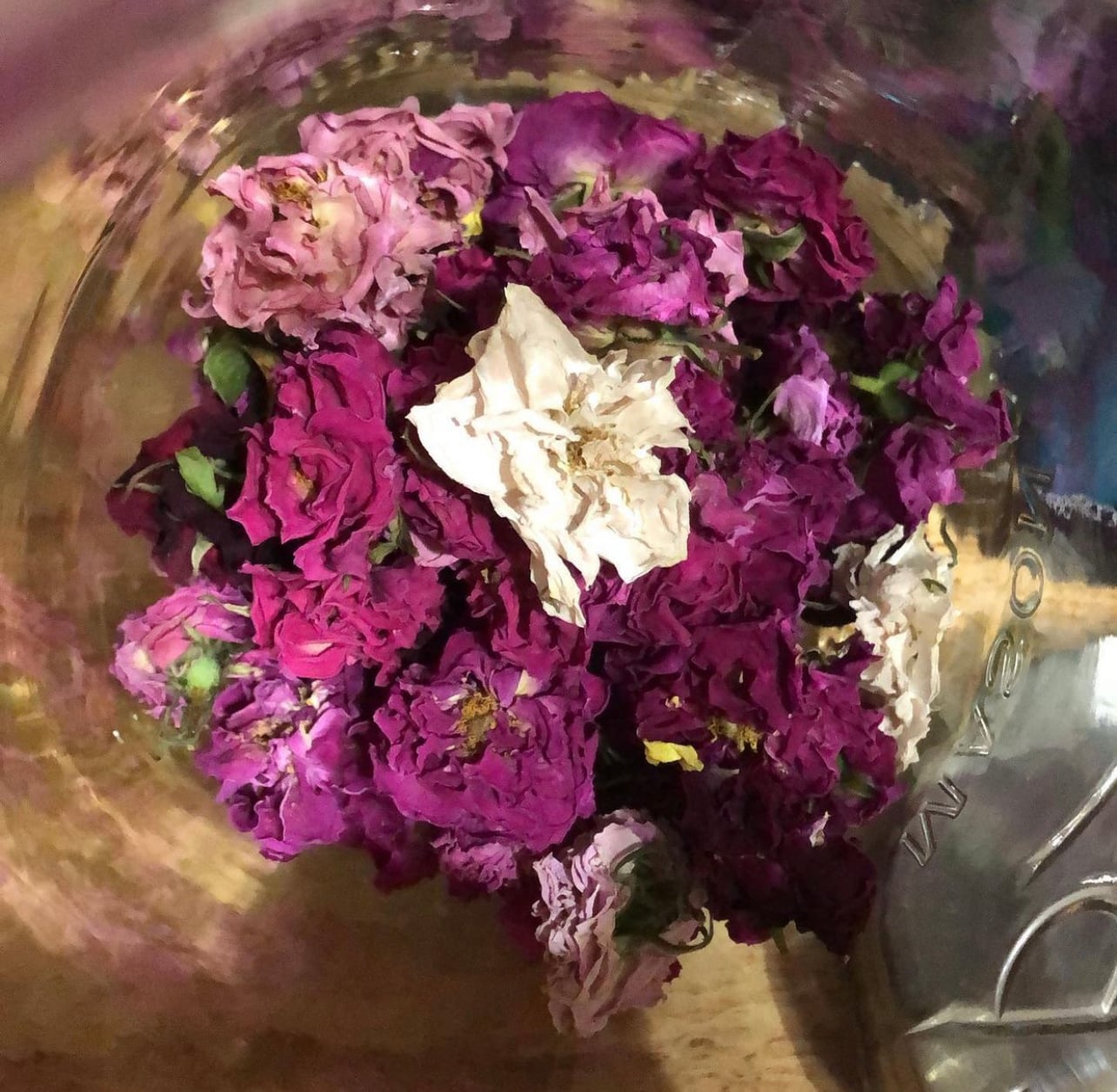 Dried rose petals the author uses for potpourri, teas, and jams