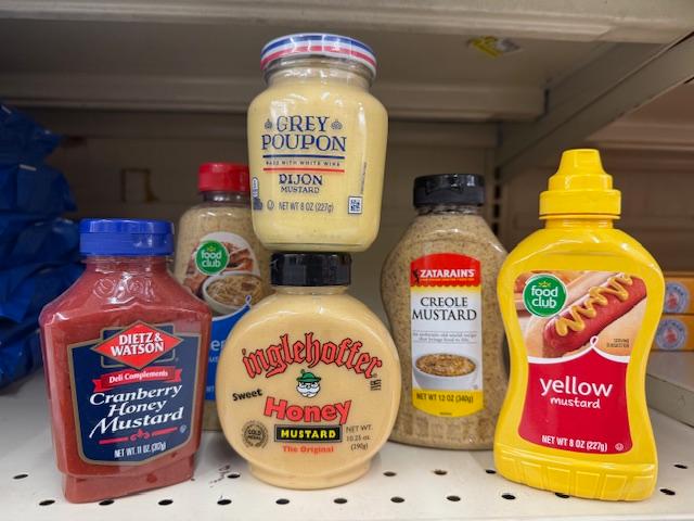 A display of different types of mustard spreads