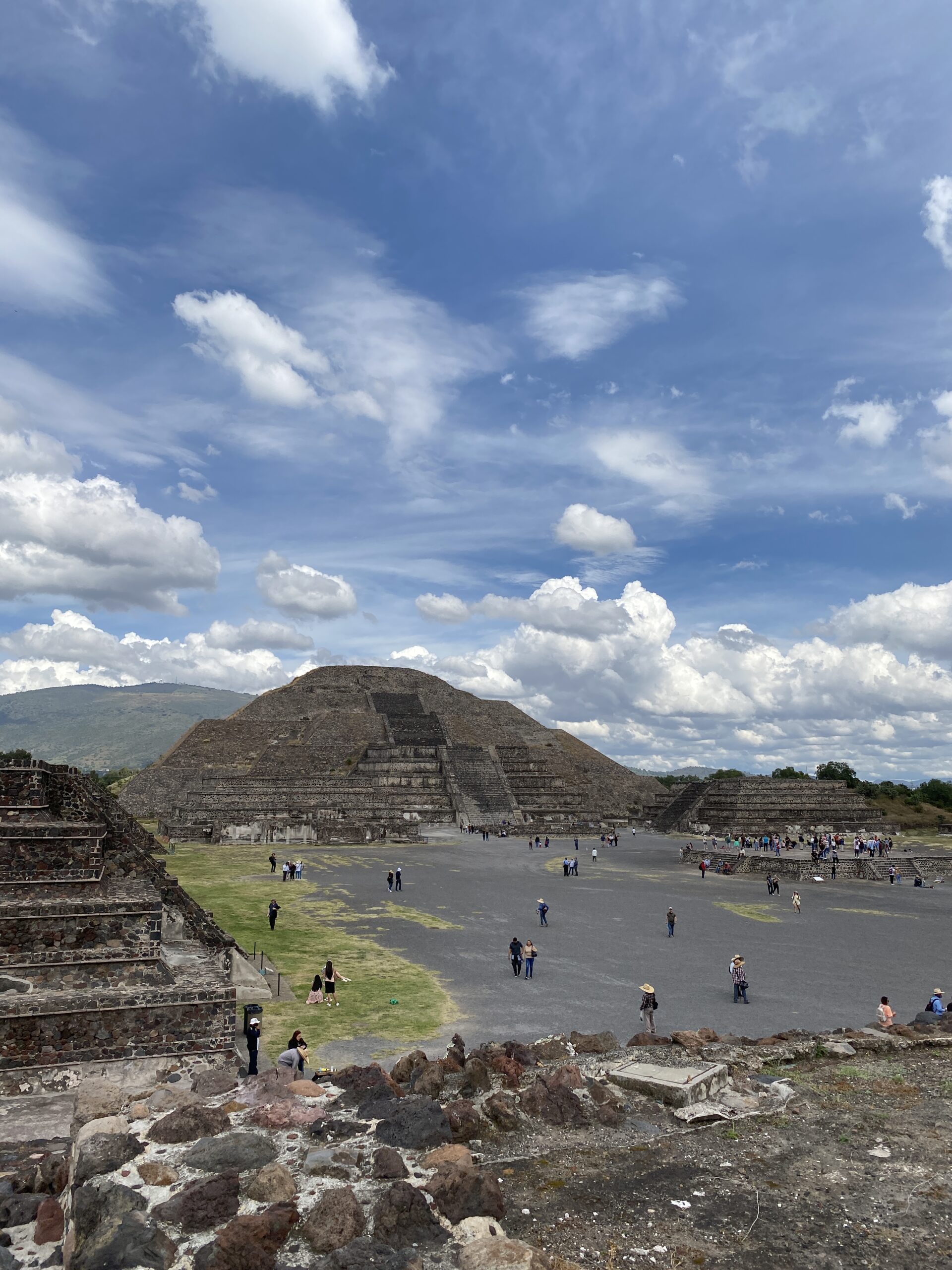 Pyramid of the Moon, Teotihuacan. Ancient pyramid under a blue sky with puffy white clouds