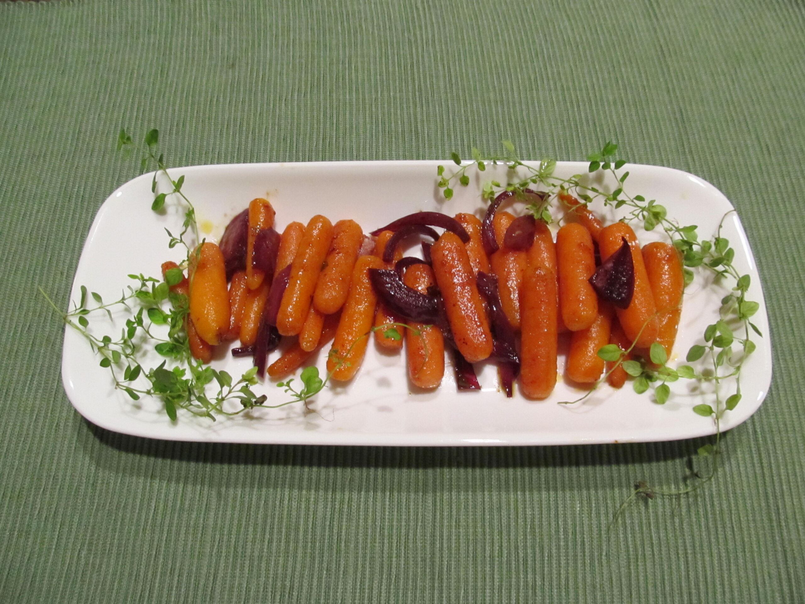 Thyme sprigs with cooked carrots