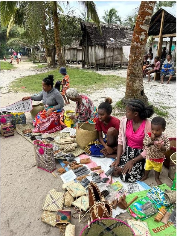 Village women selling spices and straw products in Madagascar